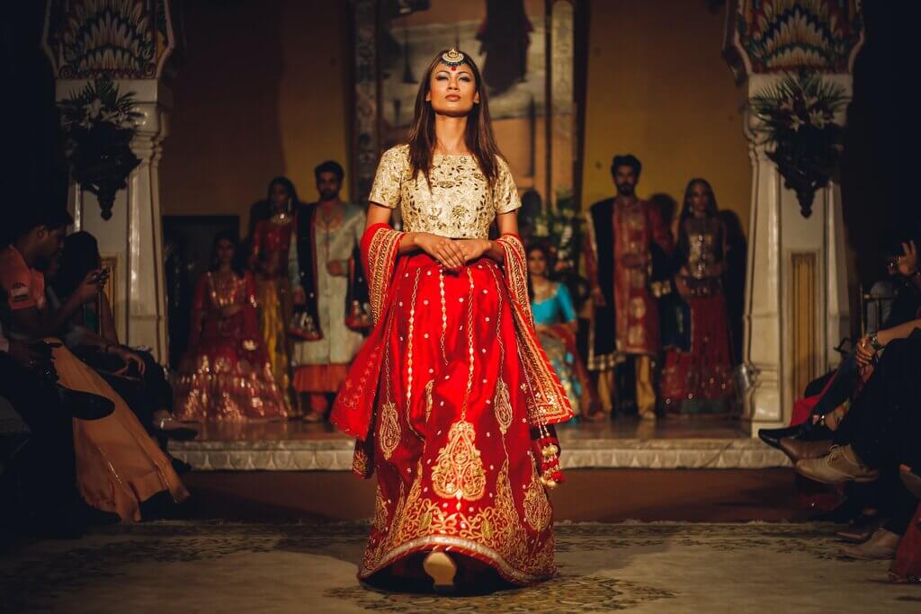 a girl wearing embroidered guest wedding dresses