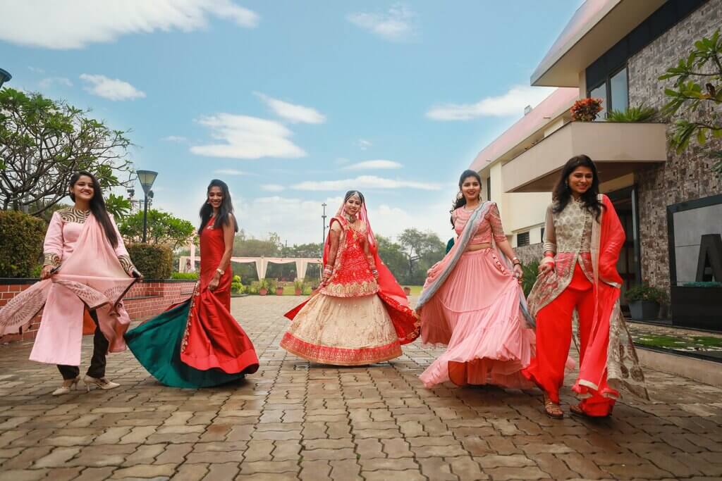 bridesmaid wearing unique outfits