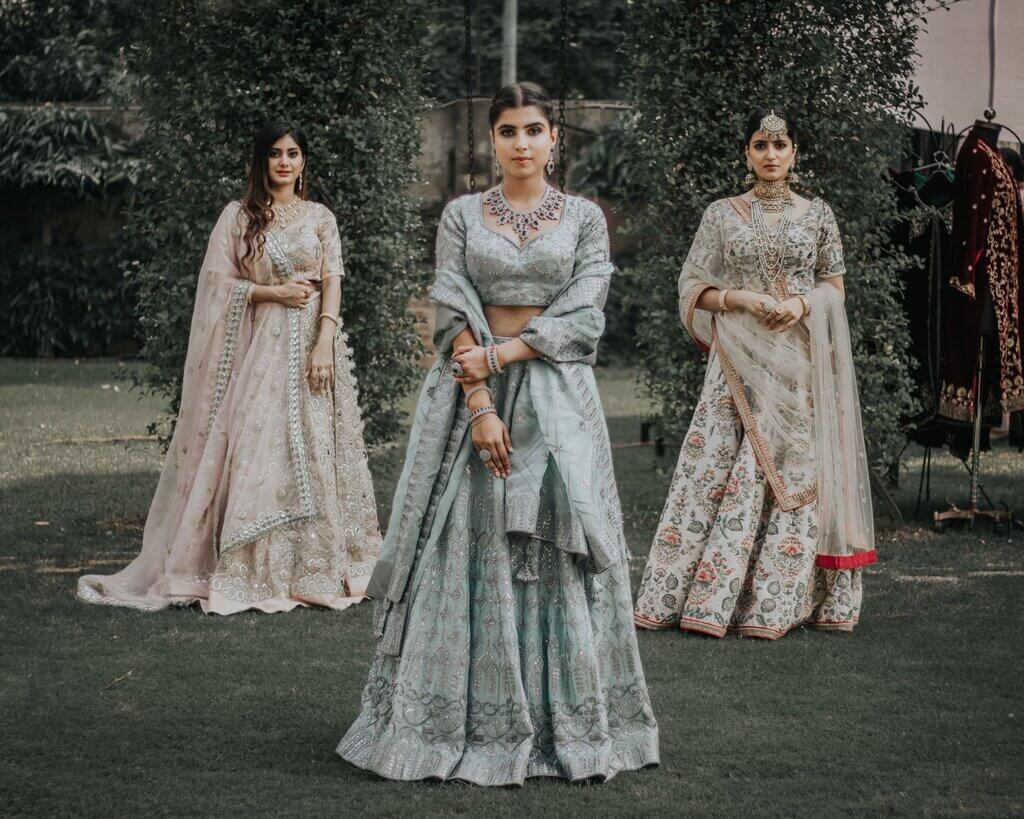 ladies wearing lehengas